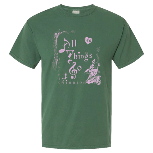 Green t-shirt with pink graphic design on a white background